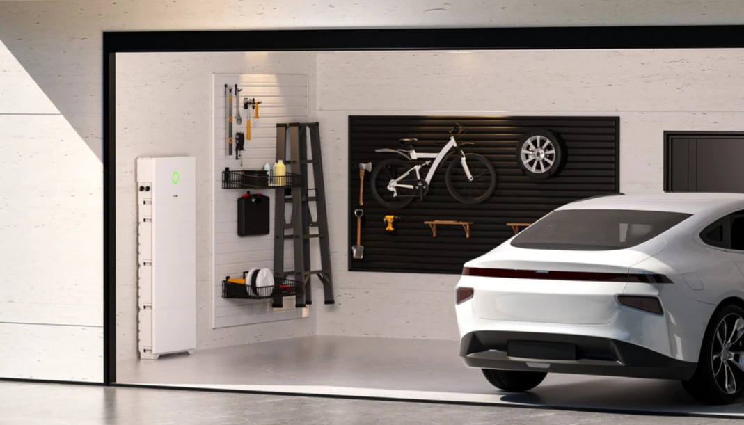 HS3 is positioned as a single wall-mounted hub for PV, storage, backup and EV charging. SAJ HS3 all-in-one home energy hub installed in a garage next to an electric car (render).